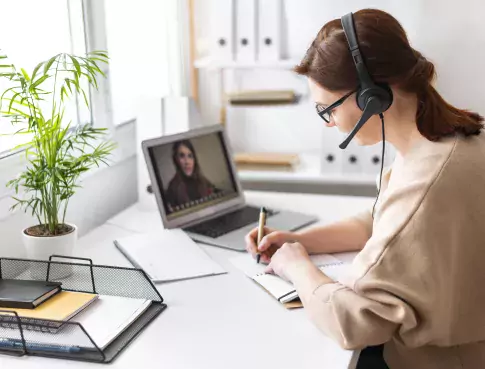 portrait-woman-work-having-video-call-laptop