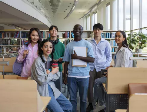 full-shot-smiley-students-library