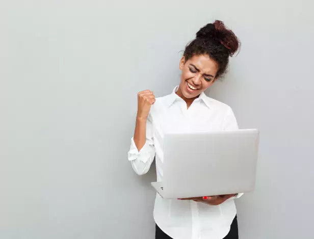 cheerful-business-woman-make-winner-gesture