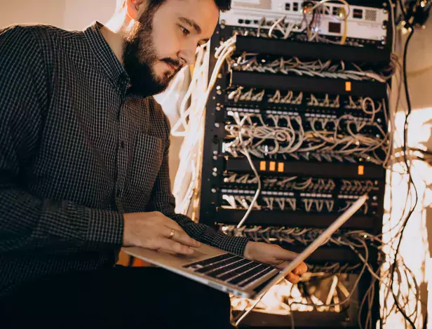 young-it-service-man-repairing-computer