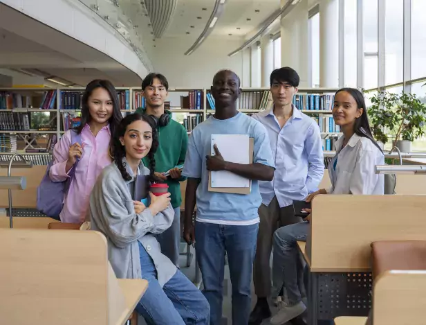 full-shot-smiley-students-library